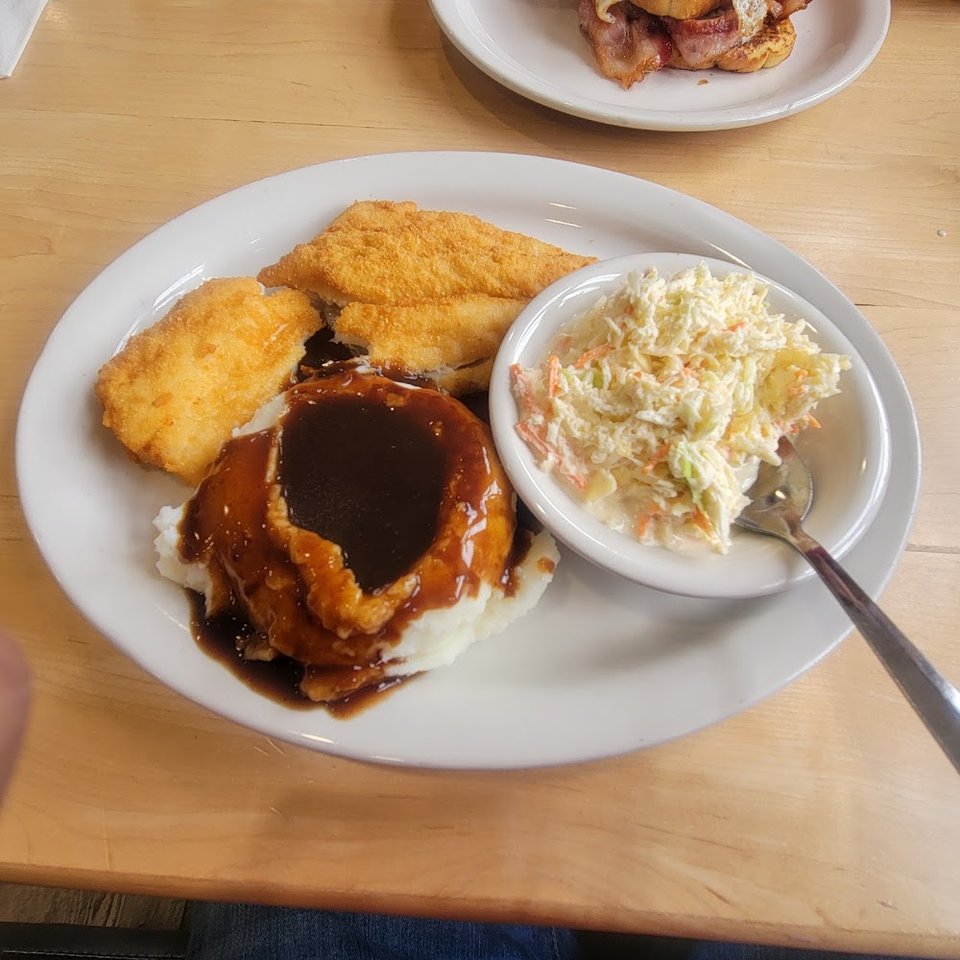 Diner menu listing simple breakfast and comfort dishes.