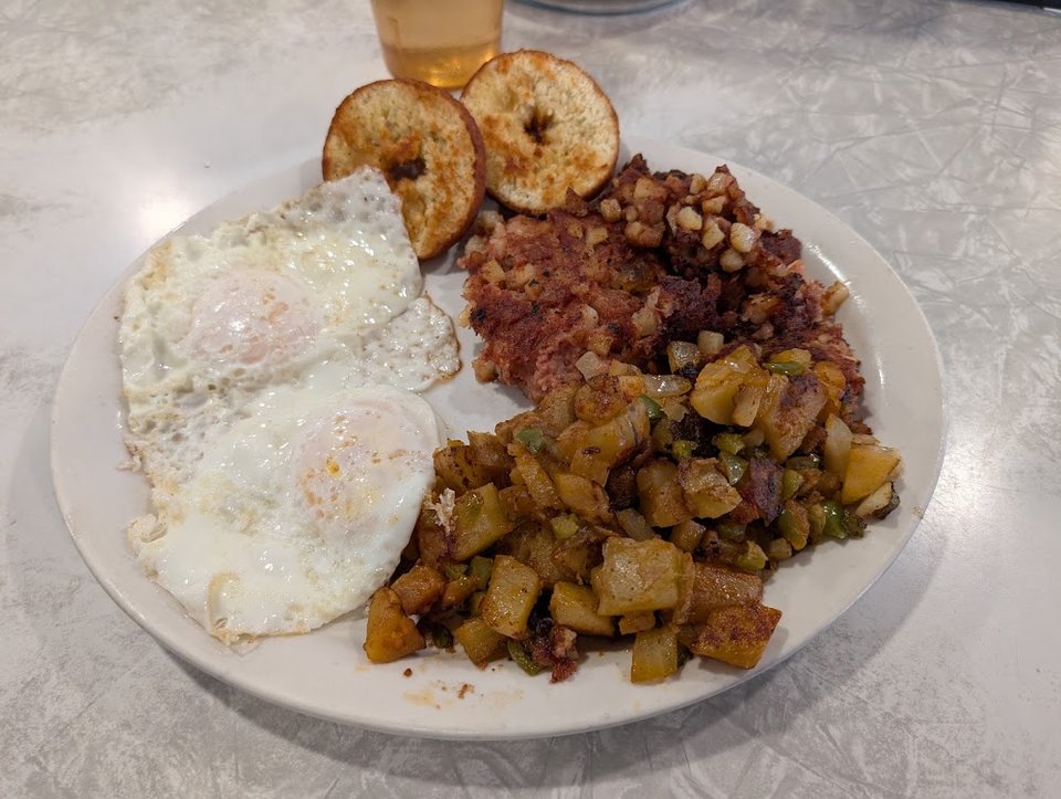 Printed diner menu with breakfast and dinner sections.