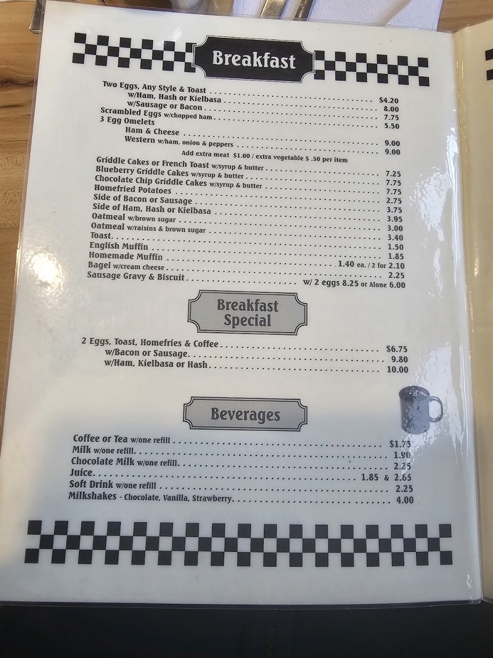 Diner menu listing simple breakfast and comfort dishes.